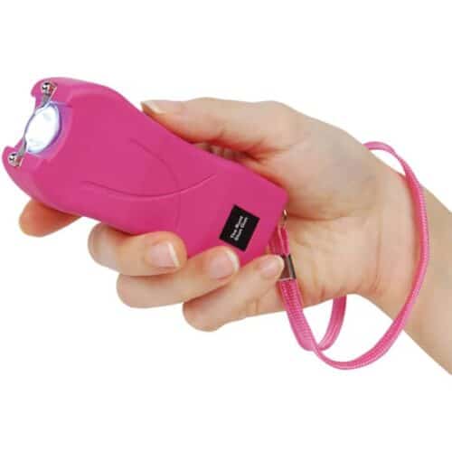 Pink Runt Rechargeable Stun Gun With Flashlight and Wrist Strap Disable Pin In Hand