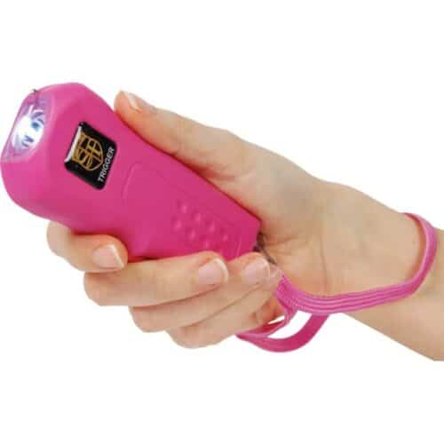 Pink Safety Technology Trigger Rechargeable Stun Gun With Flashlight and Wrist Strap Disable Pin In Hand