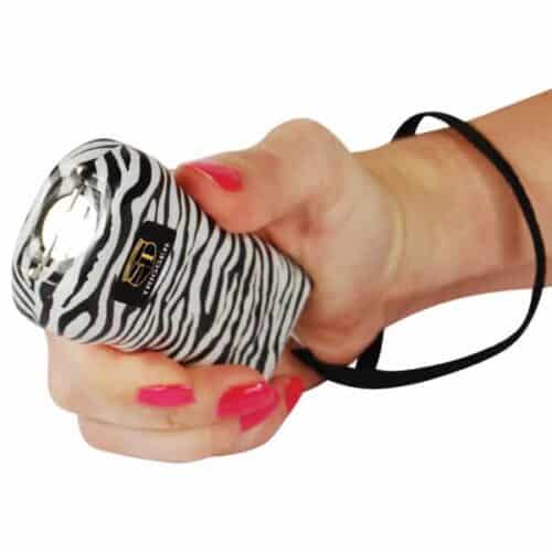 Zebra Print Safety Technology Trigger Rechargeable Stun Gun With Flashlight and Wrist Strap Disable Pin In Hand