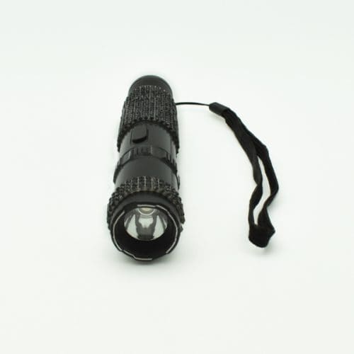 Black tactical flashlight with textured grip and wrist strap on a white background.