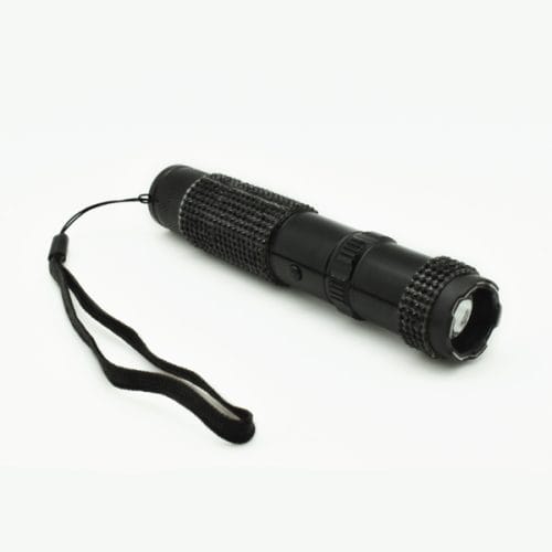 Black tactical flashlight with textured grip and wrist strap on a white background.