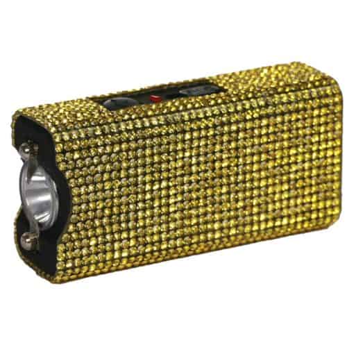 Gold rhinestone-covered stun gun flashlight, combining style with personal safety.