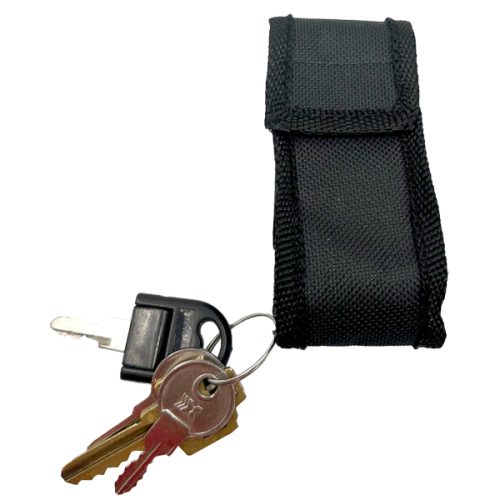 Black keychain pouch with a set of keys on a keyring, isolated on a white background.