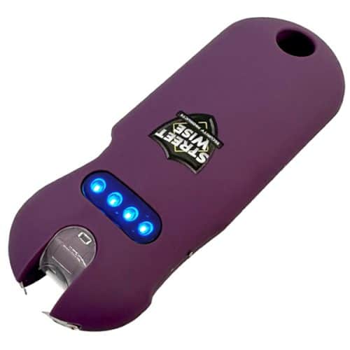 Purple personal safety device with LED indicators for self-defense. Compact design for easy carrying and protection.