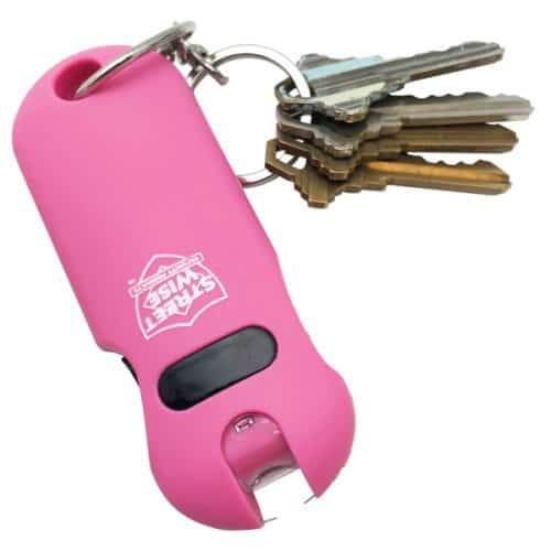 Pink pepper spray keychain with multiple keys attached, designed for personal safety and easy access.