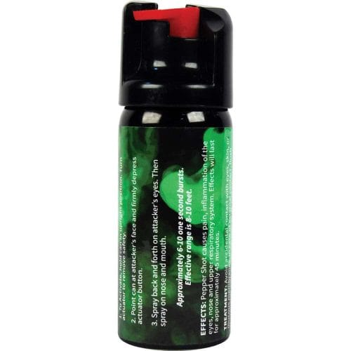 Pepper spray canister with instructions on label, featuring a red actuator for self-defense use.