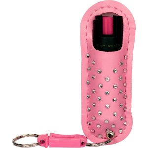 Pink pepper spray with rhinestone-studded case and keychain for personal safety.