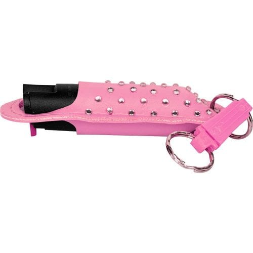 Pink pepper spray case with rhinestones and keyring attachment for personal safety and quick access.