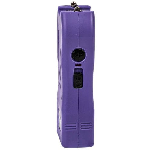 Side view of a purple handheld taser with a safety switch, showcasing its slim and compact design.